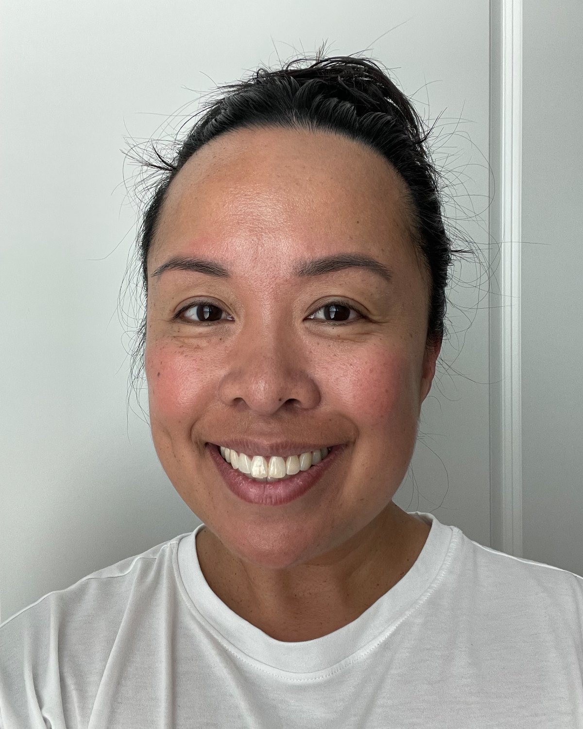Maricel R., close-up with clear, glowing skin
